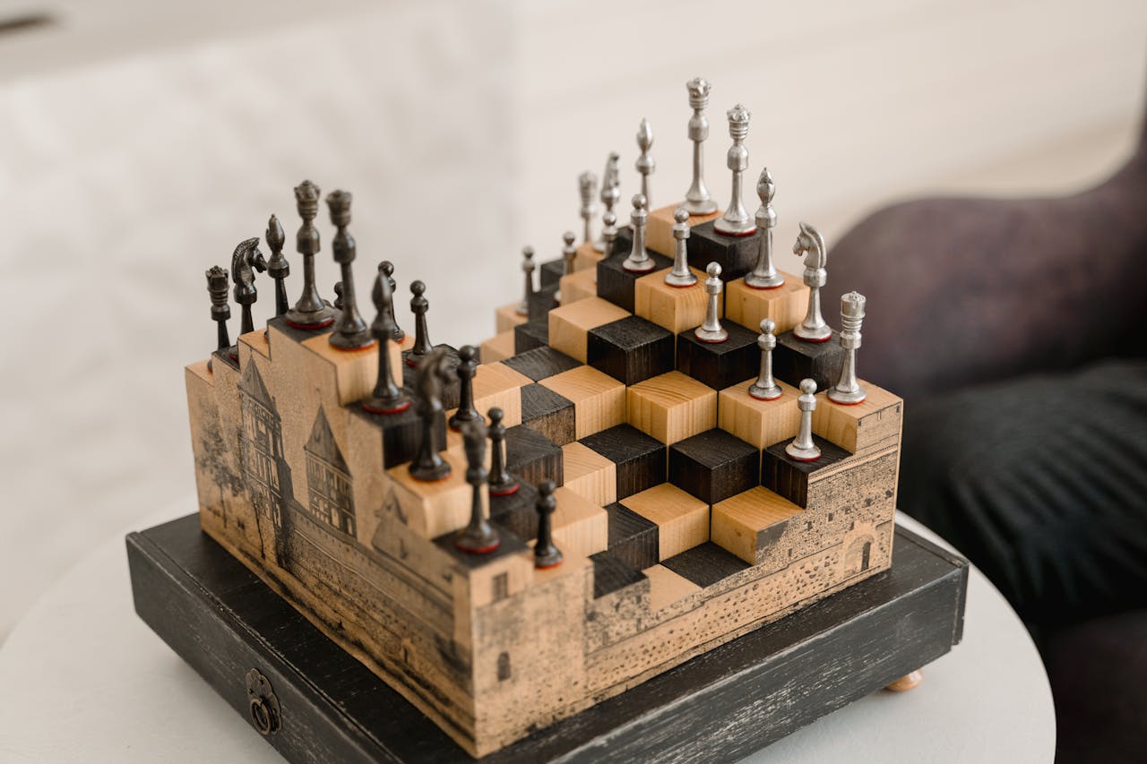 about-img Artistic chess set with 3D pieces on an intricate wooden board indoors.